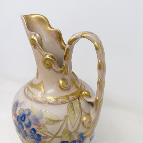 729 - A Doulton Lambeth jug by Frank A Butler, decorated flowers, highlighted in gilt, 26 cm high