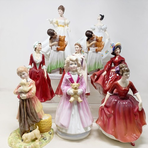 731 - A Royal Doulton figure, Gwynneth Lilac Time HN2137, Faith HN3082, Winter Welcome HN3611, And One For... 