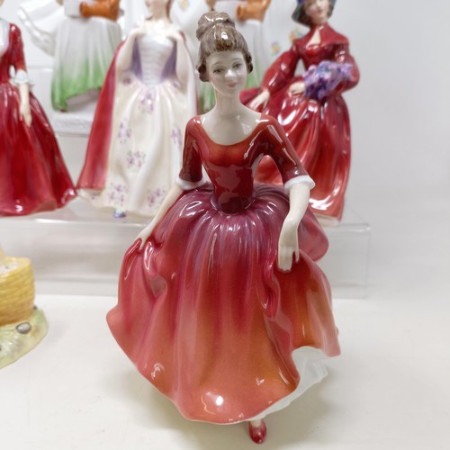 731 - A Royal Doulton figure, Gwynneth Lilac Time HN2137, Faith HN3082, Winter Welcome HN3611, And One For... 