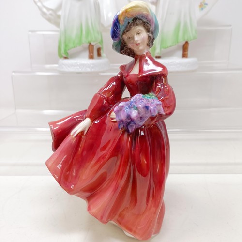 731 - A Royal Doulton figure, Gwynneth Lilac Time HN2137, Faith HN3082, Winter Welcome HN3611, And One For... 