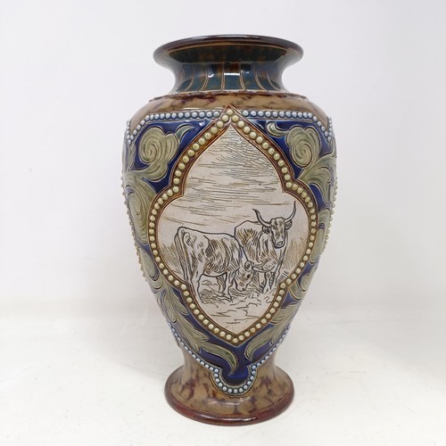 734 - A Royal Doulton vase, by Hannah Barlow, decorated with cows, 27 cm high