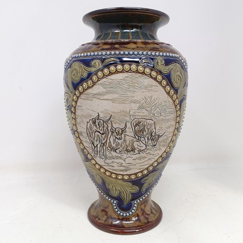 734 - A Royal Doulton vase, by Hannah Barlow, decorated with cows, 27 cm high