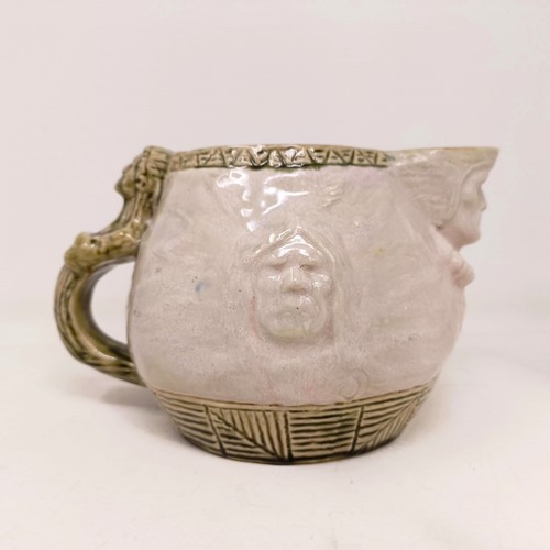 742 - A Doulton Lambeth jug, by Edward Kemeys, decorated with native American Indians, 13 cm high