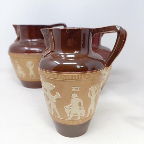 744 - A graduated set of Doulton Lambeth jugs, 20 cm, 18 cm and 14 cm, and another similar, 18 cm (4)