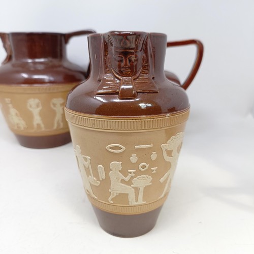 744 - A graduated set of Doulton Lambeth jugs, 20 cm, 18 cm and 14 cm, and another similar, 18 cm (4)