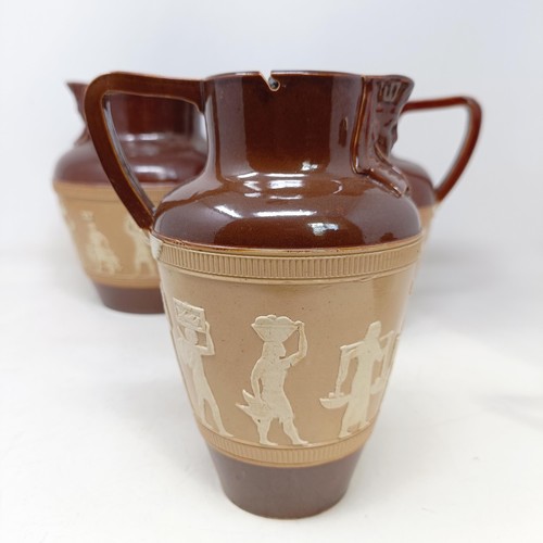 744 - A graduated set of Doulton Lambeth jugs, 20 cm, 18 cm and 14 cm, and another similar, 18 cm (4)