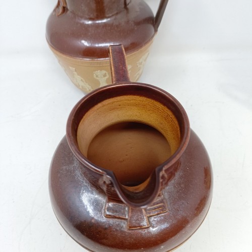 744 - A graduated set of Doulton Lambeth jugs, 20 cm, 18 cm and 14 cm, and another similar, 18 cm (4)