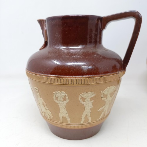 744 - A graduated set of Doulton Lambeth jugs, 20 cm, 18 cm and 14 cm, and another similar, 18 cm (4)