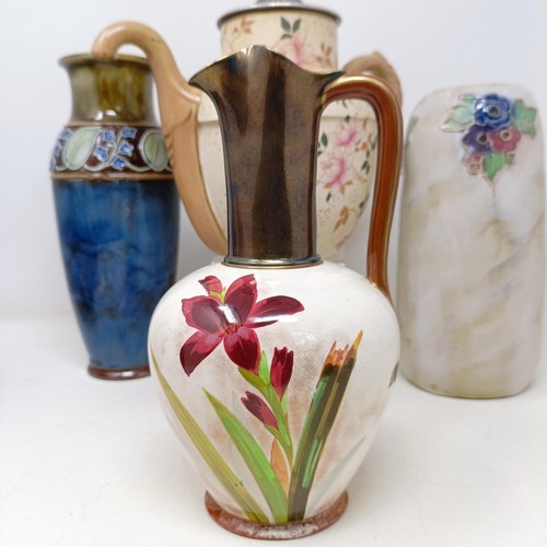 750 - A Royal Doulton Flambé vase, 17 cm high, a Doulton Burslem teapot, two Doulton vases and two ... 