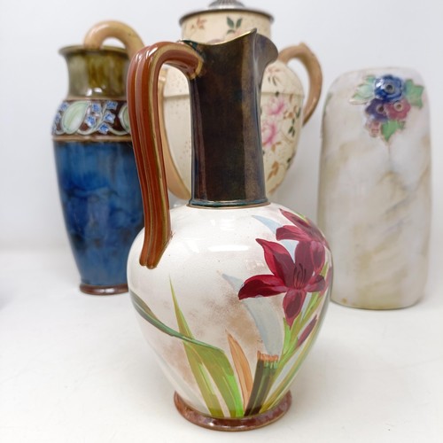 750 - A Royal Doulton Flambé vase, 17 cm high, a Doulton Burslem teapot, two Doulton vases and two ... 