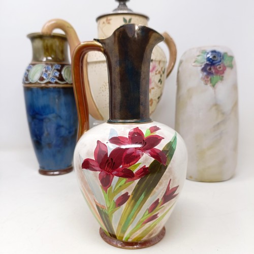 750 - A Royal Doulton Flambé vase, 17 cm high, a Doulton Burslem teapot, two Doulton vases and two ... 