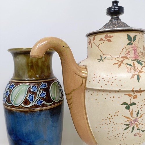 750 - A Royal Doulton Flambé vase, 17 cm high, a Doulton Burslem teapot, two Doulton vases and two ... 