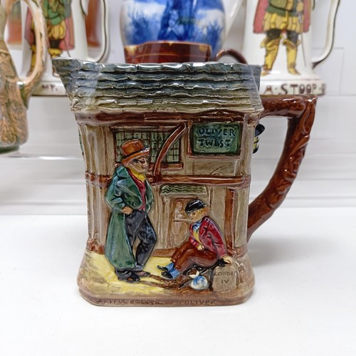 753 - A Royal Doulton jug, decorated figure, 21 cm high, a Royal Doulton jug, Oliver Twist D5617, and The ... 