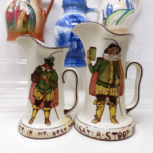 753 - A Royal Doulton jug, decorated figure, 21 cm high, a Royal Doulton jug, Oliver Twist D5617, and The ... 