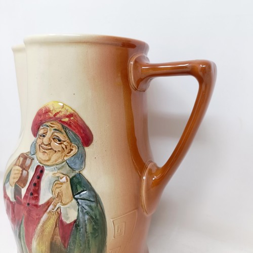 753 - A Royal Doulton jug, decorated figure, 21 cm high, a Royal Doulton jug, Oliver Twist D5617, and The ... 