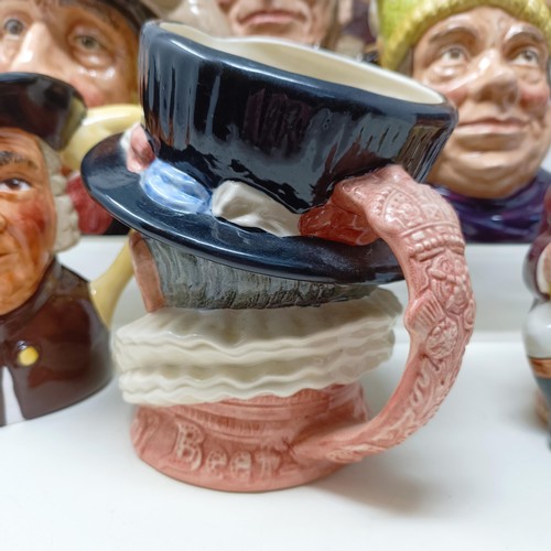 755 - A Royal Doulton character jug, The Falconer D6533, Viking D6496, a Toby jug, Jolly Toby, a character... 