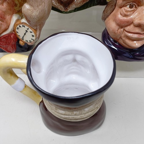 755 - A Royal Doulton character jug, The Falconer D6533, Viking D6496, a Toby jug, Jolly Toby, a character... 