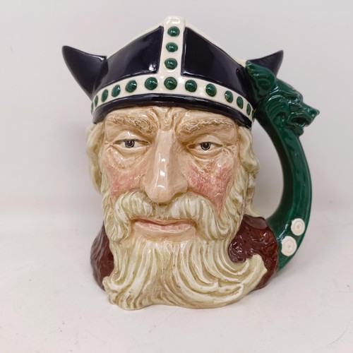 755 - A Royal Doulton character jug, The Falconer D6533, Viking D6496, a Toby jug, Jolly Toby, a character... 