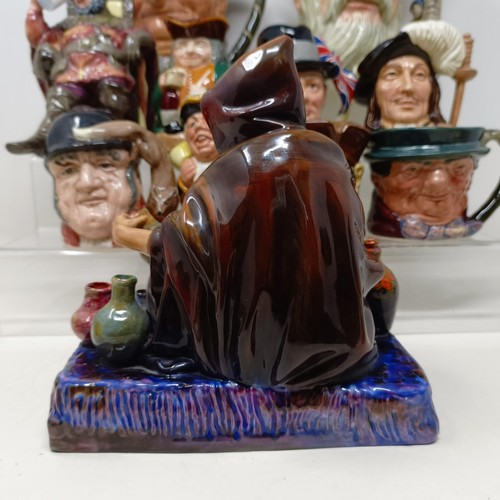 760 - A Royal Doulton character jug, Robinson Crusoe D6532, Beefeater D6206, a Royal Doulton figure, The P... 