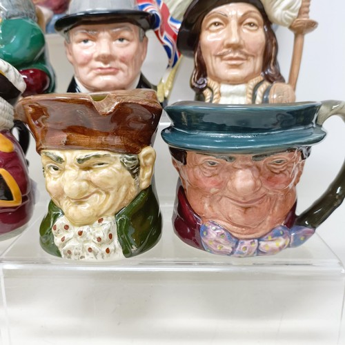 760 - A Royal Doulton character jug, Robinson Crusoe D6532, Beefeater D6206, a Royal Doulton figure, The P... 