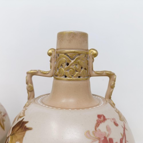 765 - A pair of Doulton Lambeth blush ivory twin handle vases, decorated flowers, highlighted in gilt, 17 ... 