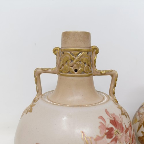 765 - A pair of Doulton Lambeth blush ivory twin handle vases, decorated flowers, highlighted in gilt, 17 ... 