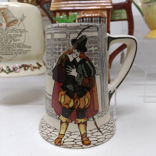 767 - A Royal Doulton Dickens Ware musical jug, The Gaffers Story, 20 cm high, a coffee pot, decorated lan... 