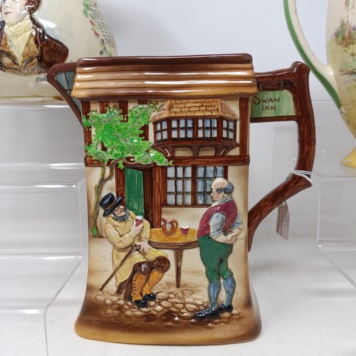 767 - A Royal Doulton Dickens Ware musical jug, The Gaffers Story, 20 cm high, a coffee pot, decorated lan... 