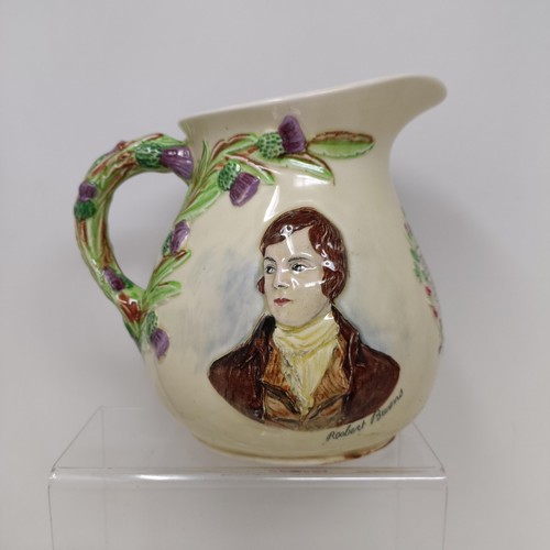 767 - A Royal Doulton Dickens Ware musical jug, The Gaffers Story, 20 cm high, a coffee pot, decorated lan... 