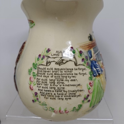 767 - A Royal Doulton Dickens Ware musical jug, The Gaffers Story, 20 cm high, a coffee pot, decorated lan... 