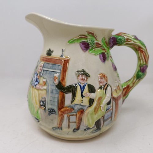 767 - A Royal Doulton Dickens Ware musical jug, The Gaffers Story, 20 cm high, a coffee pot, decorated lan... 