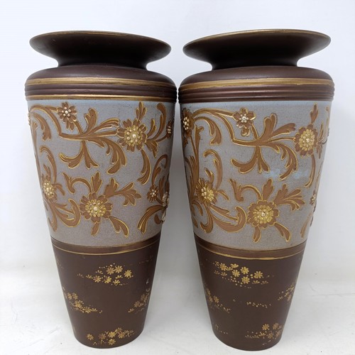 770 - A pair of Doulton Slater vases, decorated flowers, 26 cm high (2)