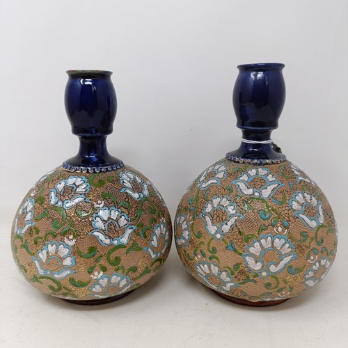 771 - A pair of Royal Doulton ewers, 29 cm high, a Royal Doulton vase, 24 cm high, a pair of Royal Doulton... 