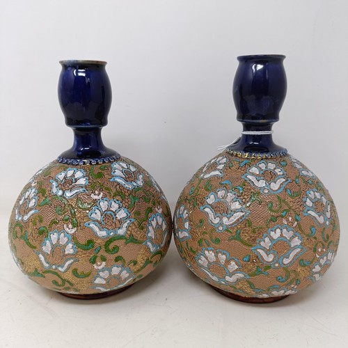 771 - A pair of Royal Doulton ewers, 29 cm high, a Royal Doulton vase, 24 cm high, a pair of Royal Doulton... 