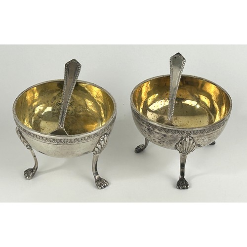 943 - A pair of Continental silver coloured metal salts, raised on legs with lion's paw feet, and a pair o... 