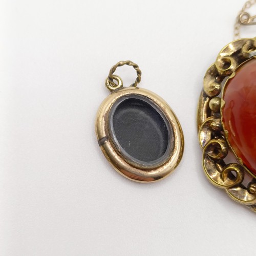 889 - An early 20th century yellow coloured metal and amber coloured stone brooch, a yellow metal and blue... 