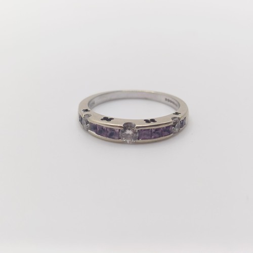 887 - An 18ct white gold, diamond and pink stone half eternity ring, ring size L