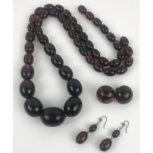 883 - An amber necklace, and two similar pairs of earringsProvenance:  Sold on behalf of Tenovus Cancer Ca... 