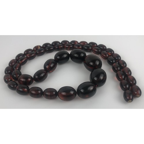 883 - An amber necklace, and two similar pairs of earringsProvenance:  Sold on behalf of Tenovus Cancer Ca... 