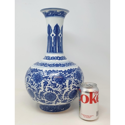 835 - A Chinese blue and white bottle vase, decorated lotus flowers in underglaze blue, 38 cm high