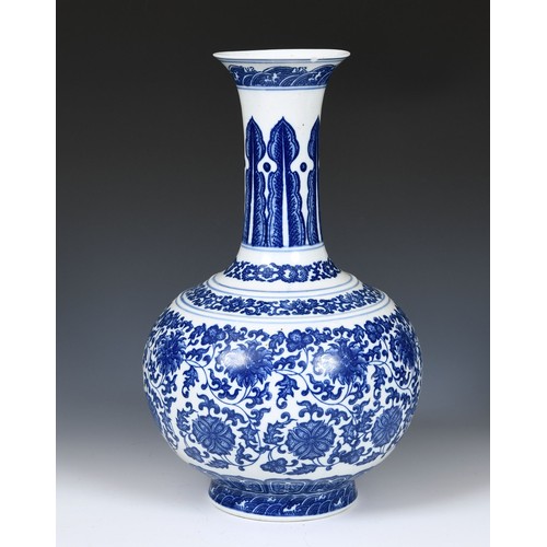 835 - A Chinese blue and white bottle vase, decorated lotus flowers in underglaze blue, 38 cm high