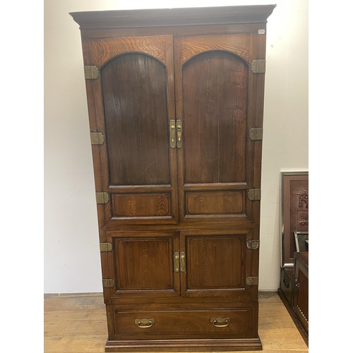 991 - A mahogany bookcase cabinet, having three glazed doors, above a base with three cupboard doors, a di... 