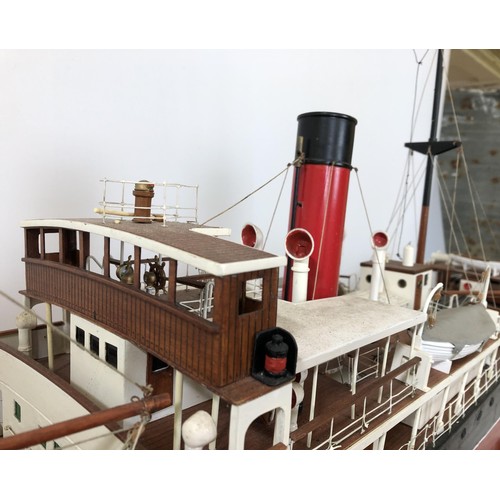 323 - A model of SS Rovuma, with a remote control, on a stand, 49 cm high x 109 cm wide