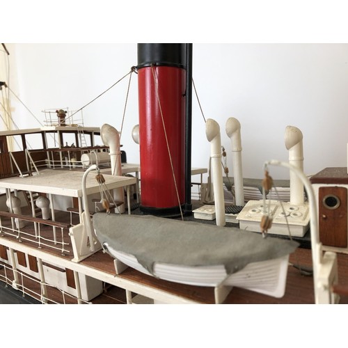 323 - A model of SS Rovuma, with a remote control, on a stand, 49 cm high x 109 cm wide