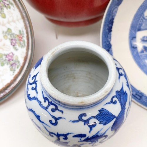 929 - A Chinese blue and white bowl, 29 cm diameter, a blue and white jar, lacking cover, 13 cm high, an e... 