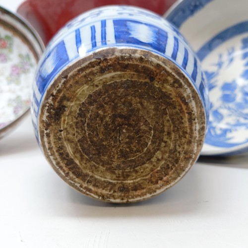 929 - A Chinese blue and white bowl, 29 cm diameter, a blue and white jar, lacking cover, 13 cm high, an e... 