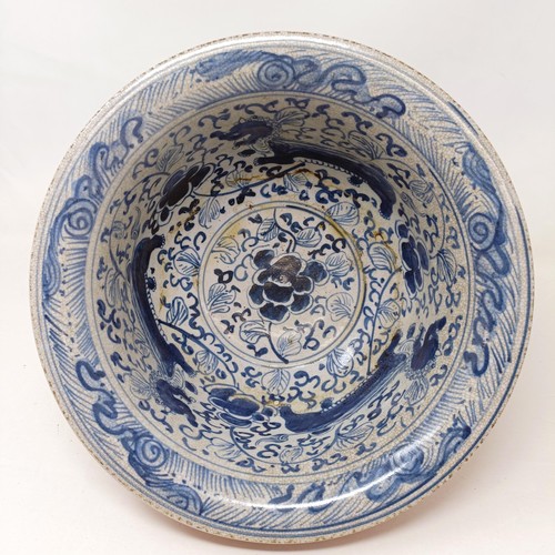 929 - A Chinese blue and white bowl, 29 cm diameter, a blue and white jar, lacking cover, 13 cm high, an e... 