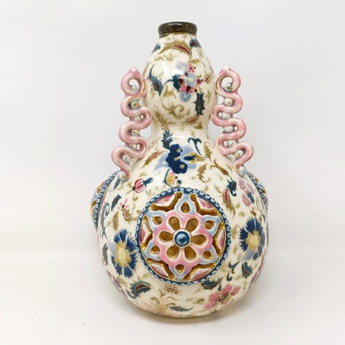 931 - A Zsolnay Pecs vase, decorated flowers and with pierced decoration, 25 cm high