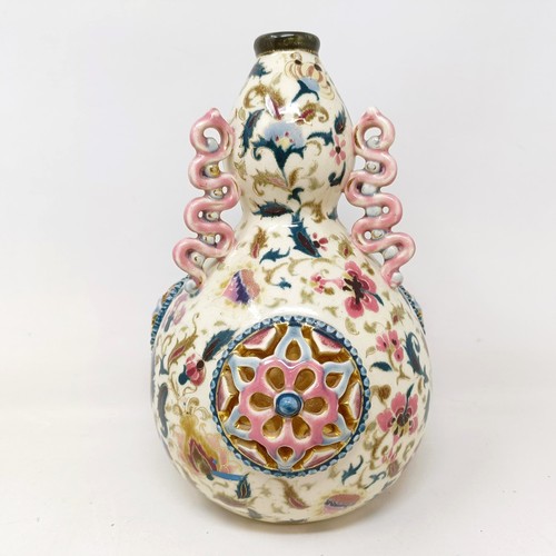 931 - A Zsolnay Pecs vase, decorated flowers and with pierced decoration, 25 cm high