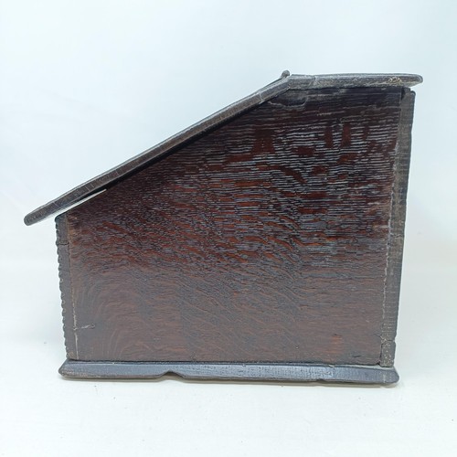 805 - An oak box, with a sloping lid, 26 cm wide